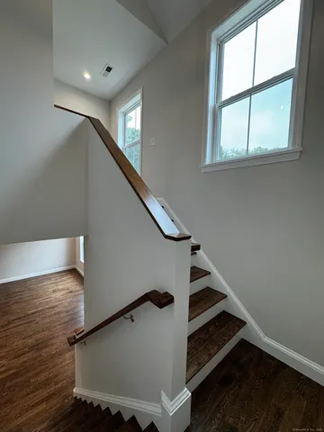 a room with a window and a wooden floor