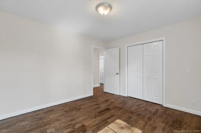 a bathroom with a granite countertop toilet a sink and bathtub