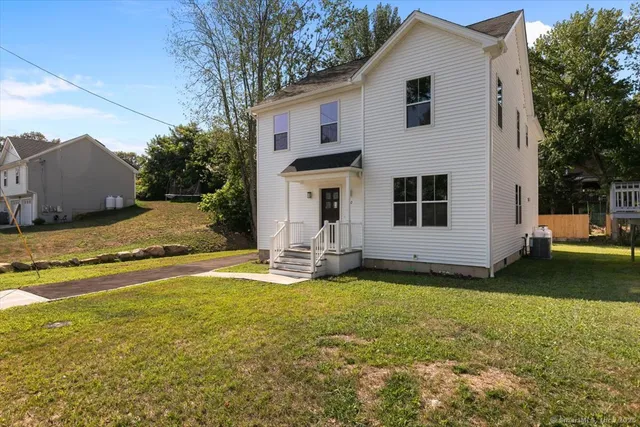a view of a house with a yard