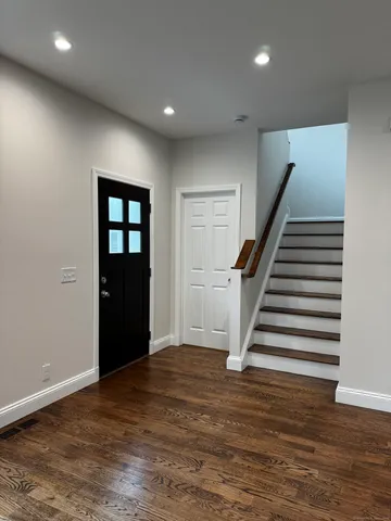 a view of kitchen and wooden floor