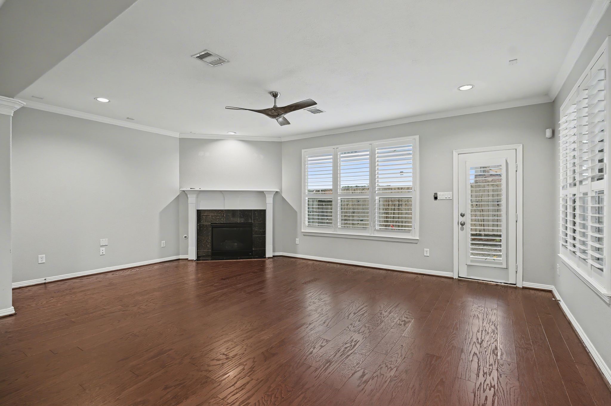 5205 Larkin Street Houston, TX 77007 - Photo 11 of 38 a view of an empty room with wooden floor and a window