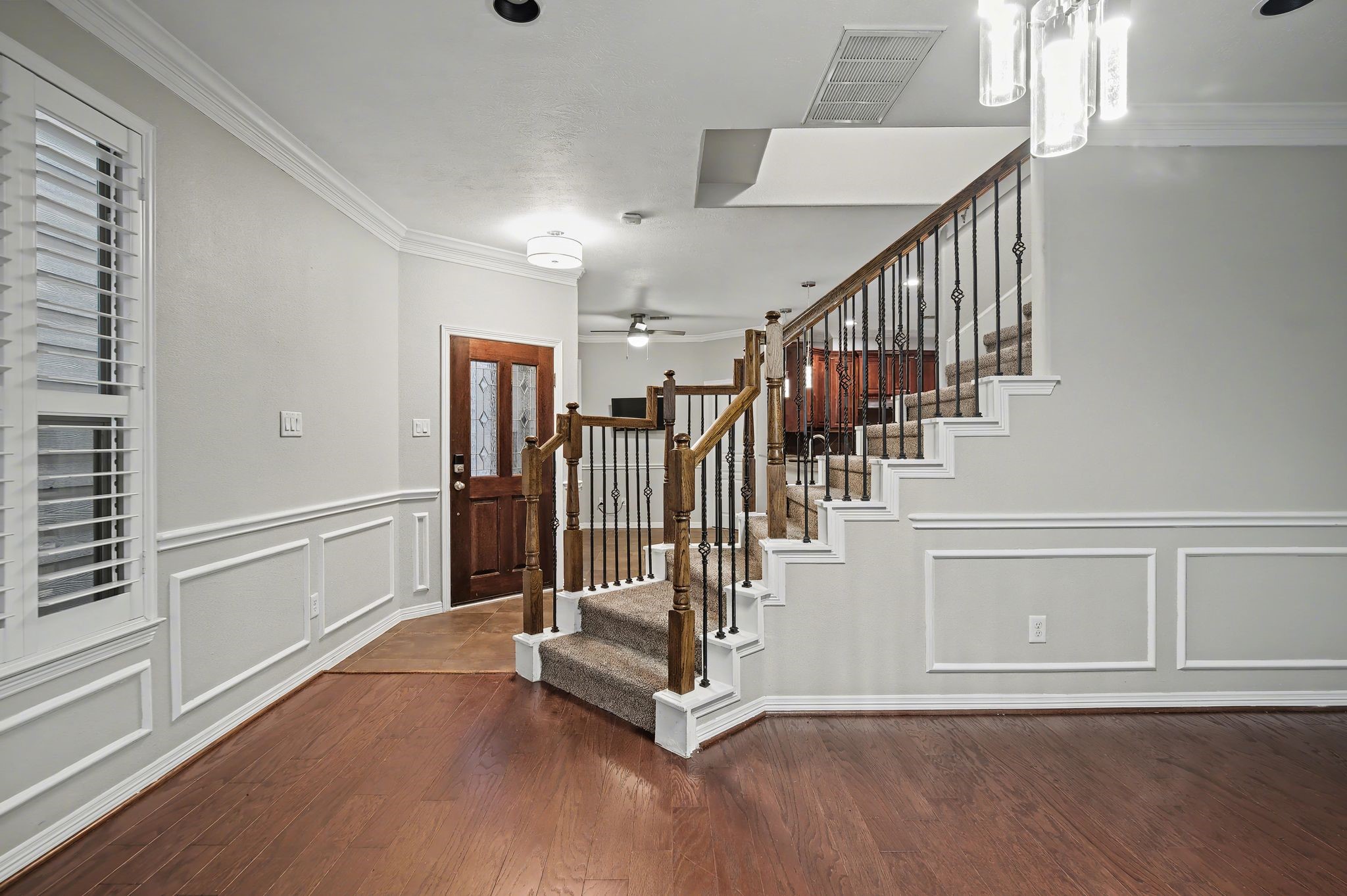 5205 Larkin Street Houston, TX 77007 - Photo 13 of 38 a view of entryway with stairs and wooden floor