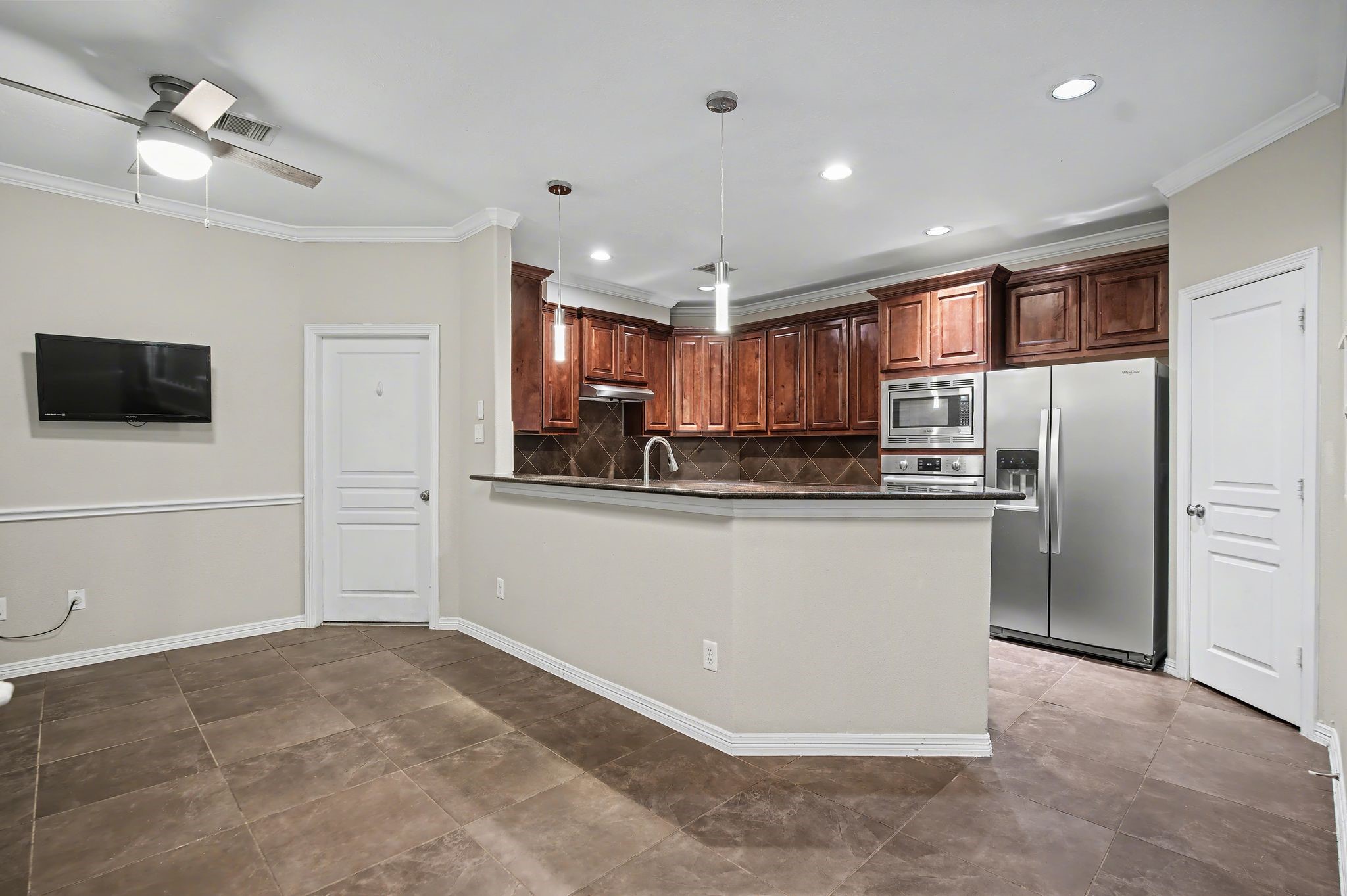 5205 Larkin Street Houston, TX 77007 - Photo 6 of 38 a large kitchen with cabinets and stainless steel appliances