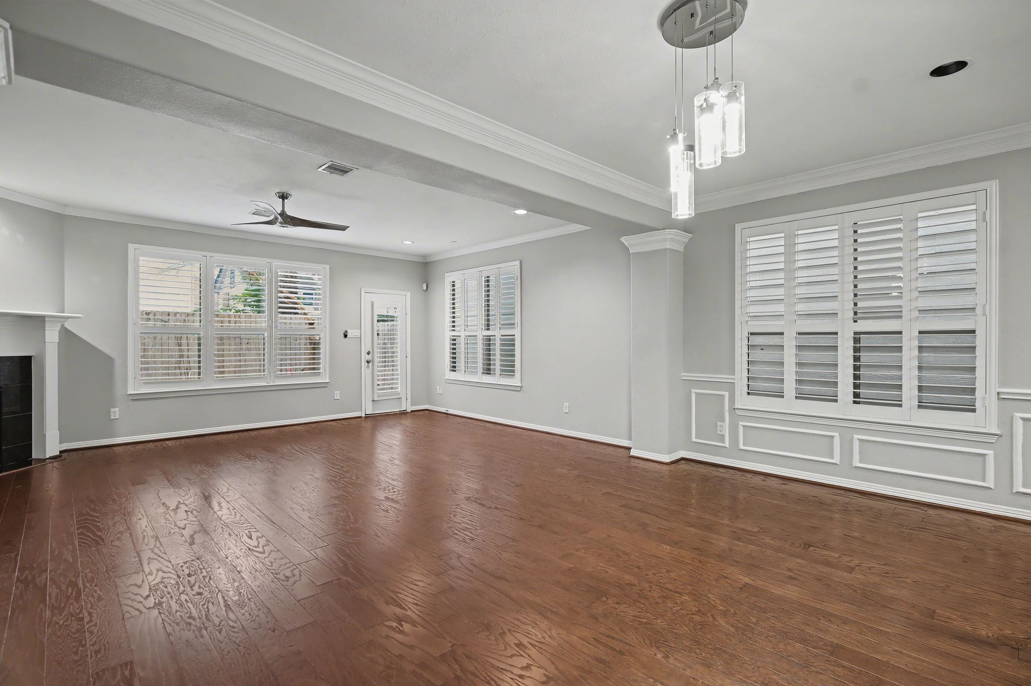 5205 Larkin Street Houston, TX 77007 - Photo 8 of 38 a view of an empty room with wooden floor and a window