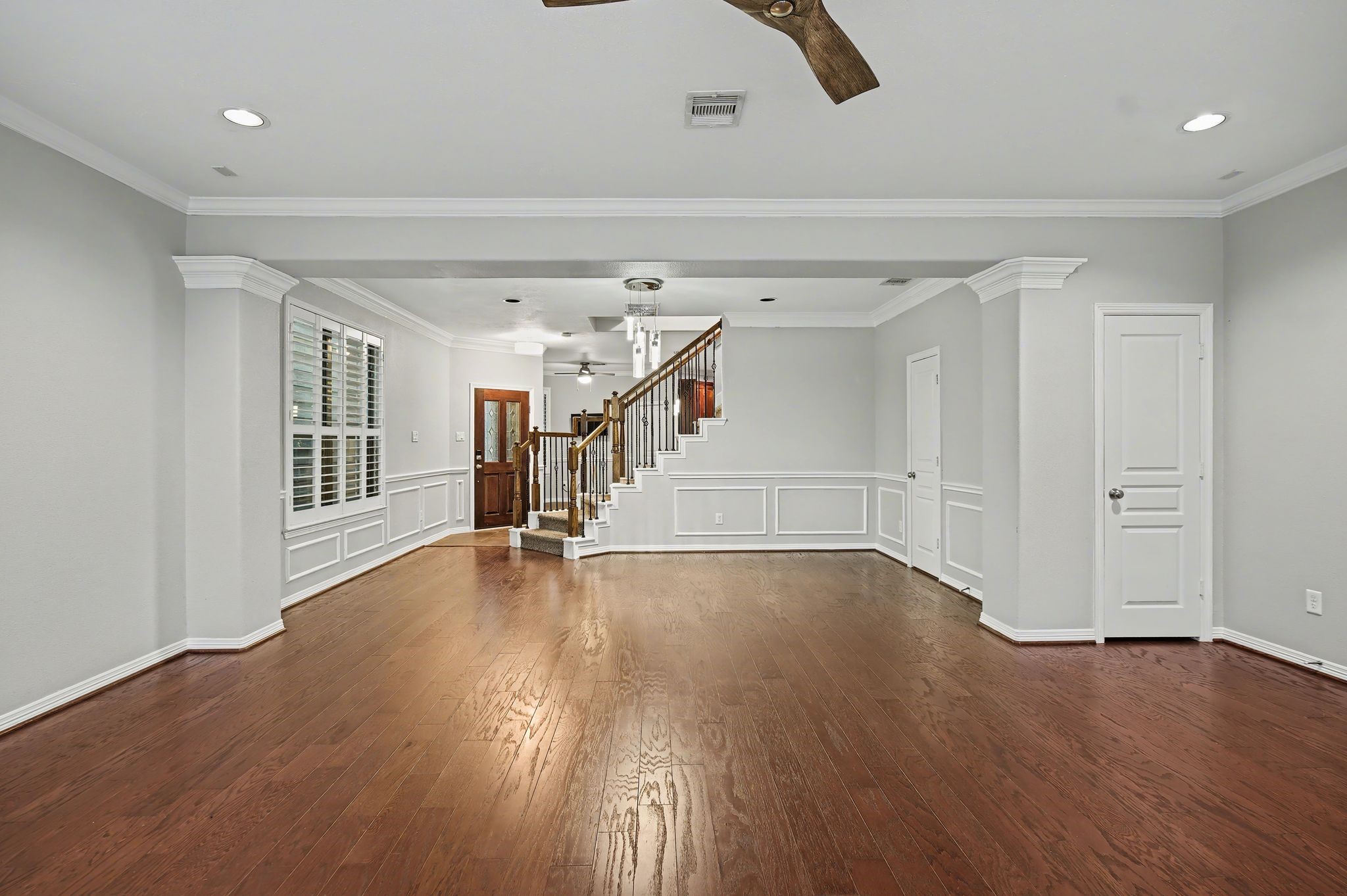 5205 Larkin Street Houston, TX 77007 - Photo 9 of 38 a view of empty room with wooden floor and fan