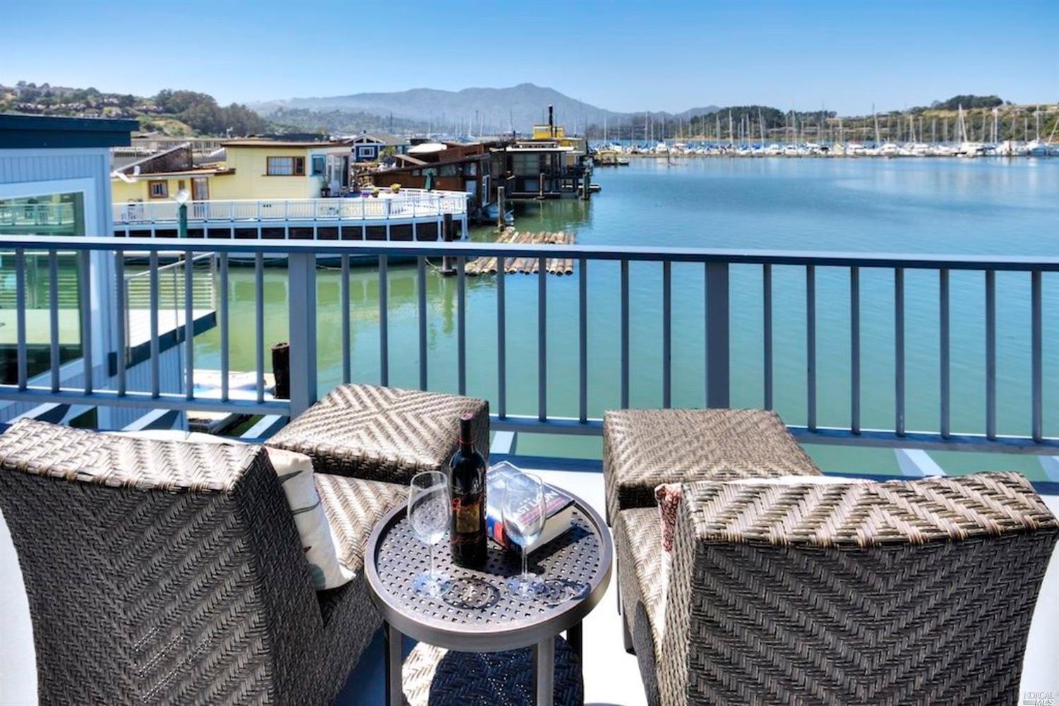 39 Issaquah Dock Sausalito, CA 94965 - Photo 1 of 1 a view of a balcony with table and chairs