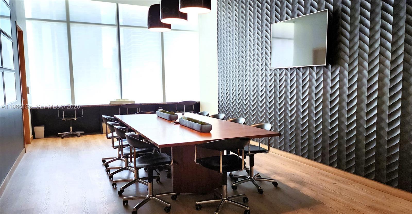 45 Southwest 9th Street, Unit 2108 Miami, FL 33130 - Photo 15 of 55 a view of a dining room with furniture and wooden floor