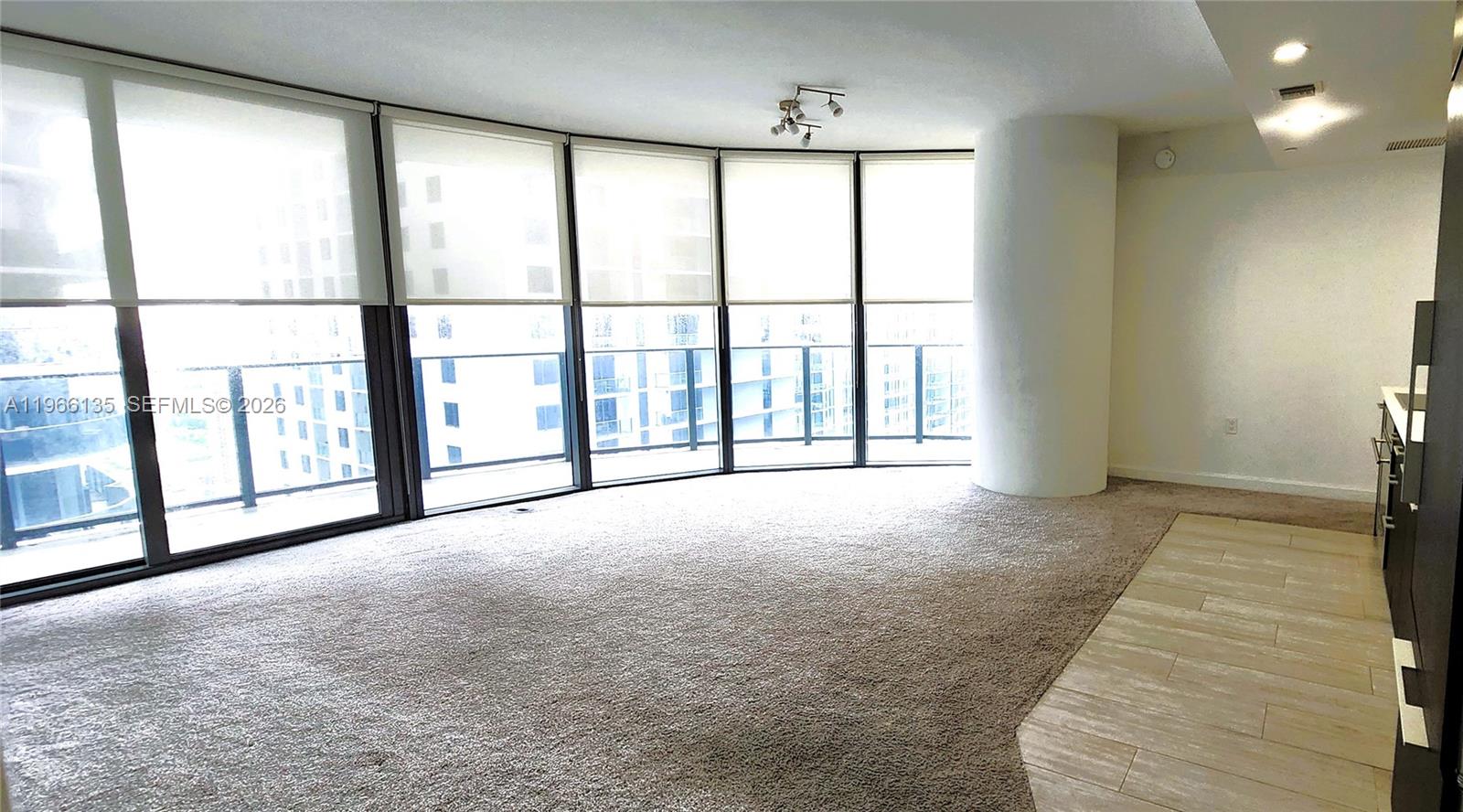 45 Southwest 9th Street, Unit 2108 Miami, FL 33130 - Photo 17 of 55 a view of an empty room with a sliding door