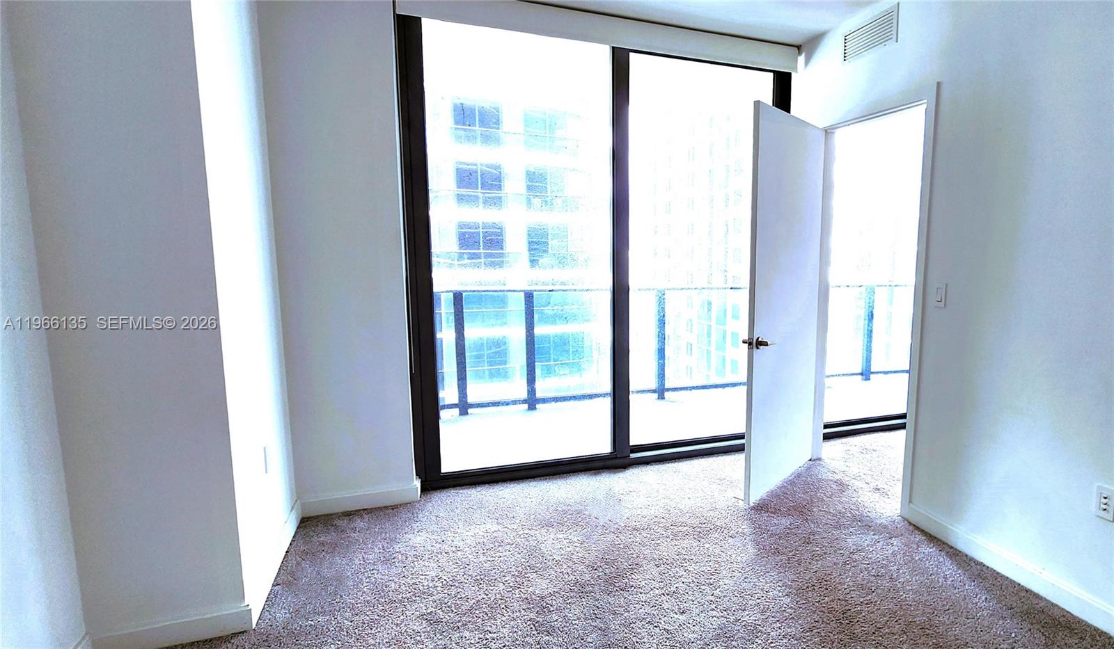 45 Southwest 9th Street, Unit 2108 Miami, FL 33130 - Photo 33 of 55 a view of empty room with floor to ceiling window
