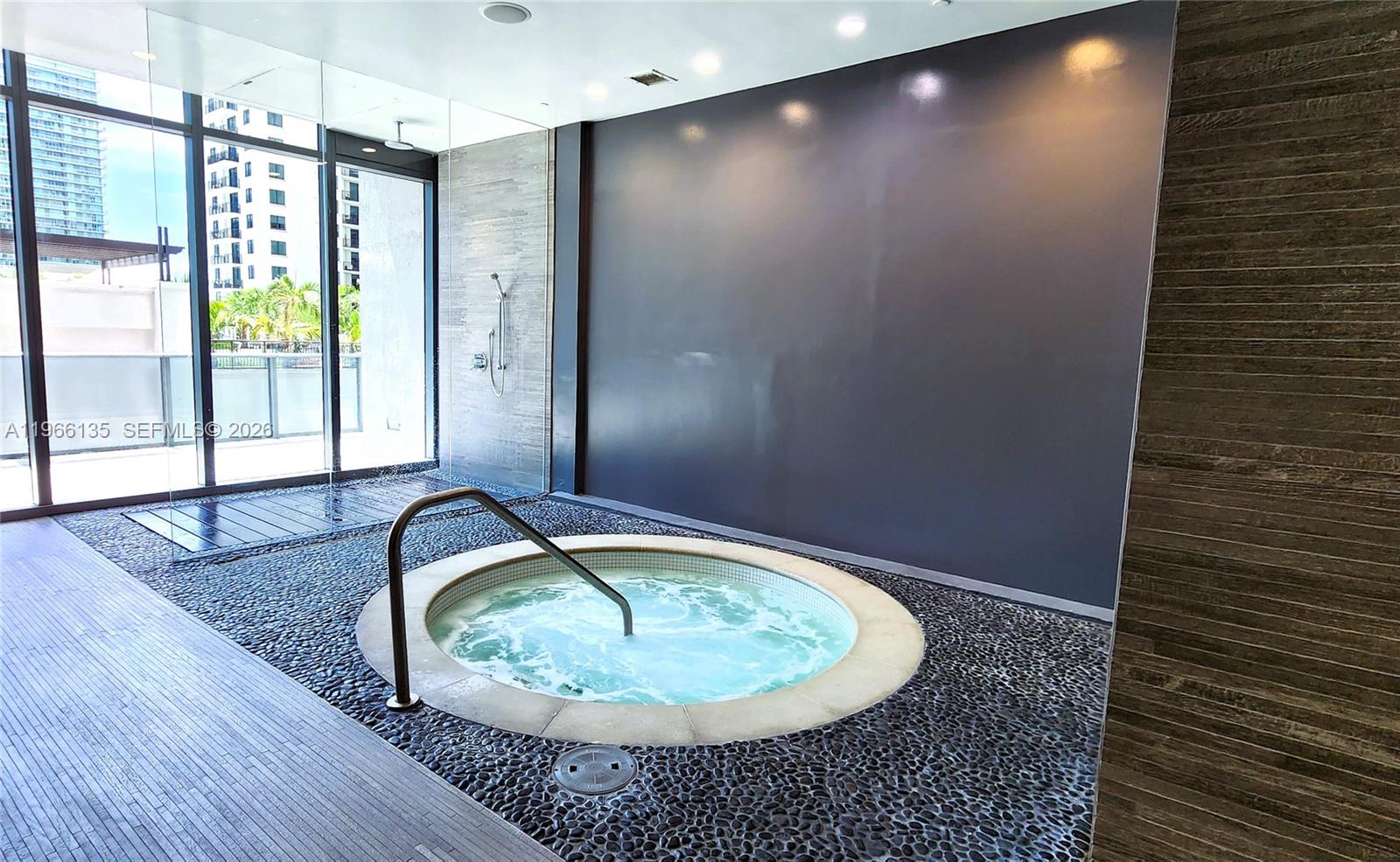 45 Southwest 9th Street, Unit 2108 Miami, FL 33130 - Photo 45 of 55 a bathroom with a granite countertop sink and a mirror