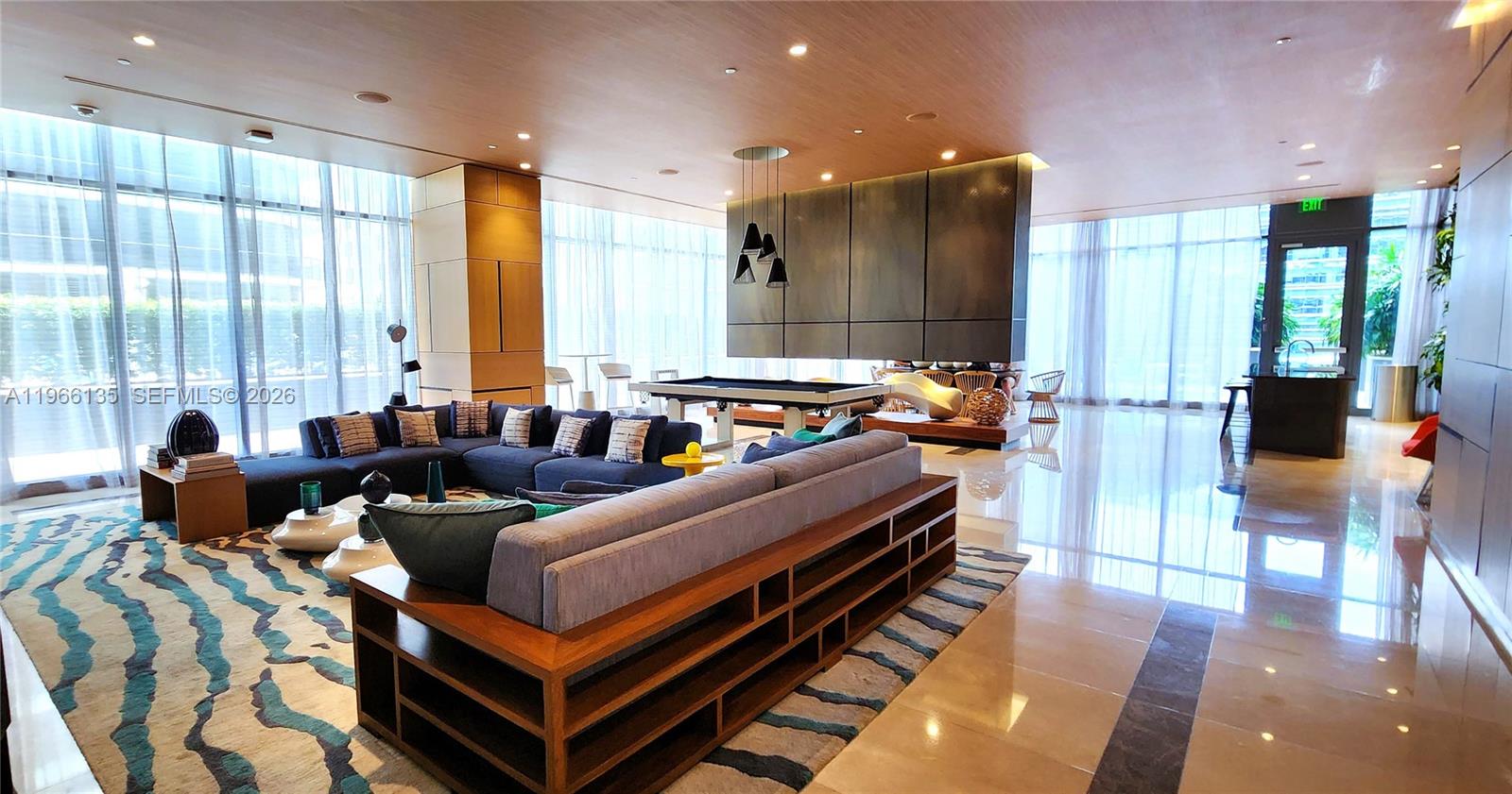 45 Southwest 9th Street, Unit 2108 Miami, FL 33130 - Photo 8 of 55 a living room with furniture a large window and a chandelier