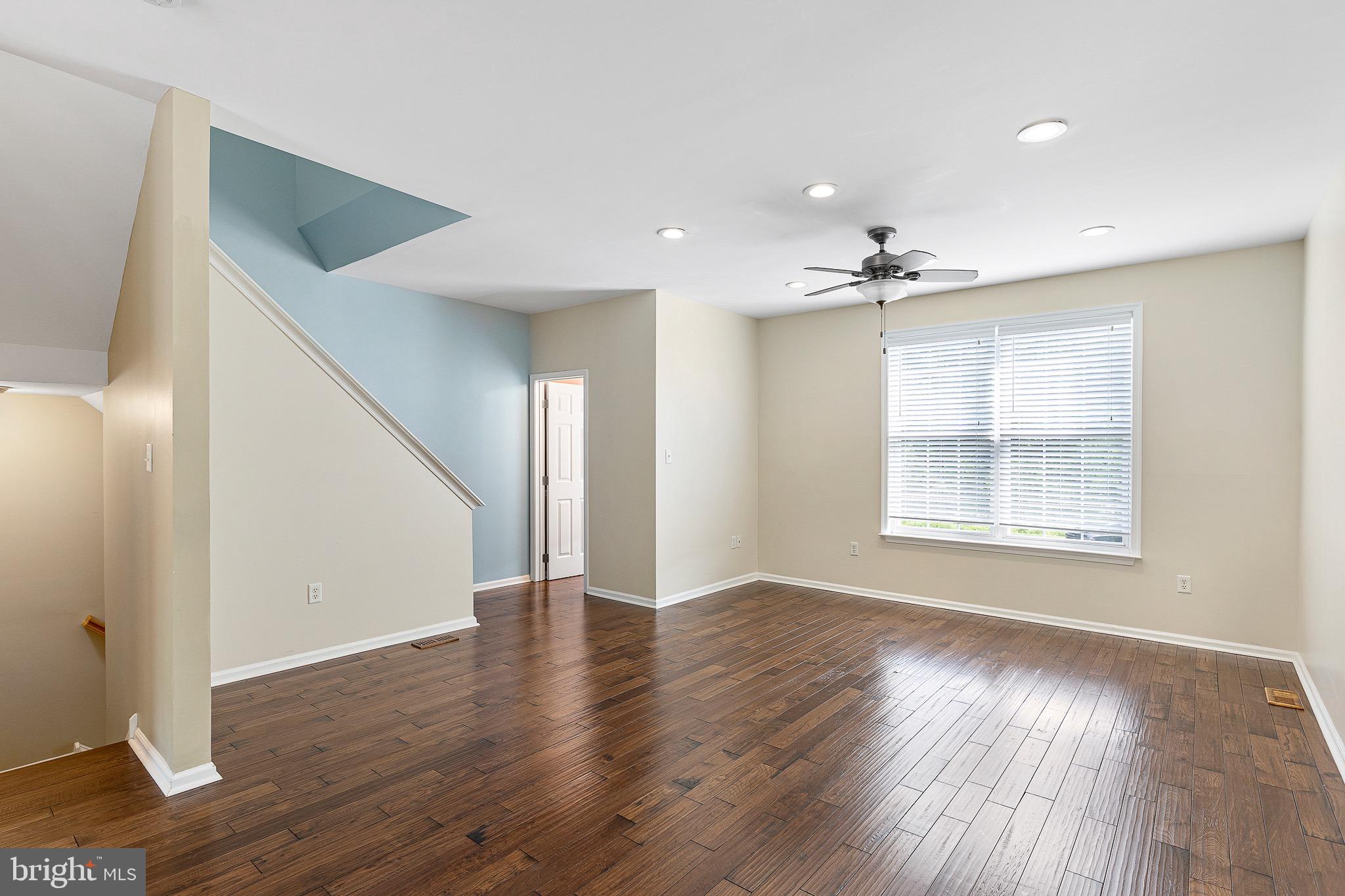 32 Ballina Boulevard Bear, DE 19701 - Photo 13 of 25 a view of an empty room with wooden floor and a window