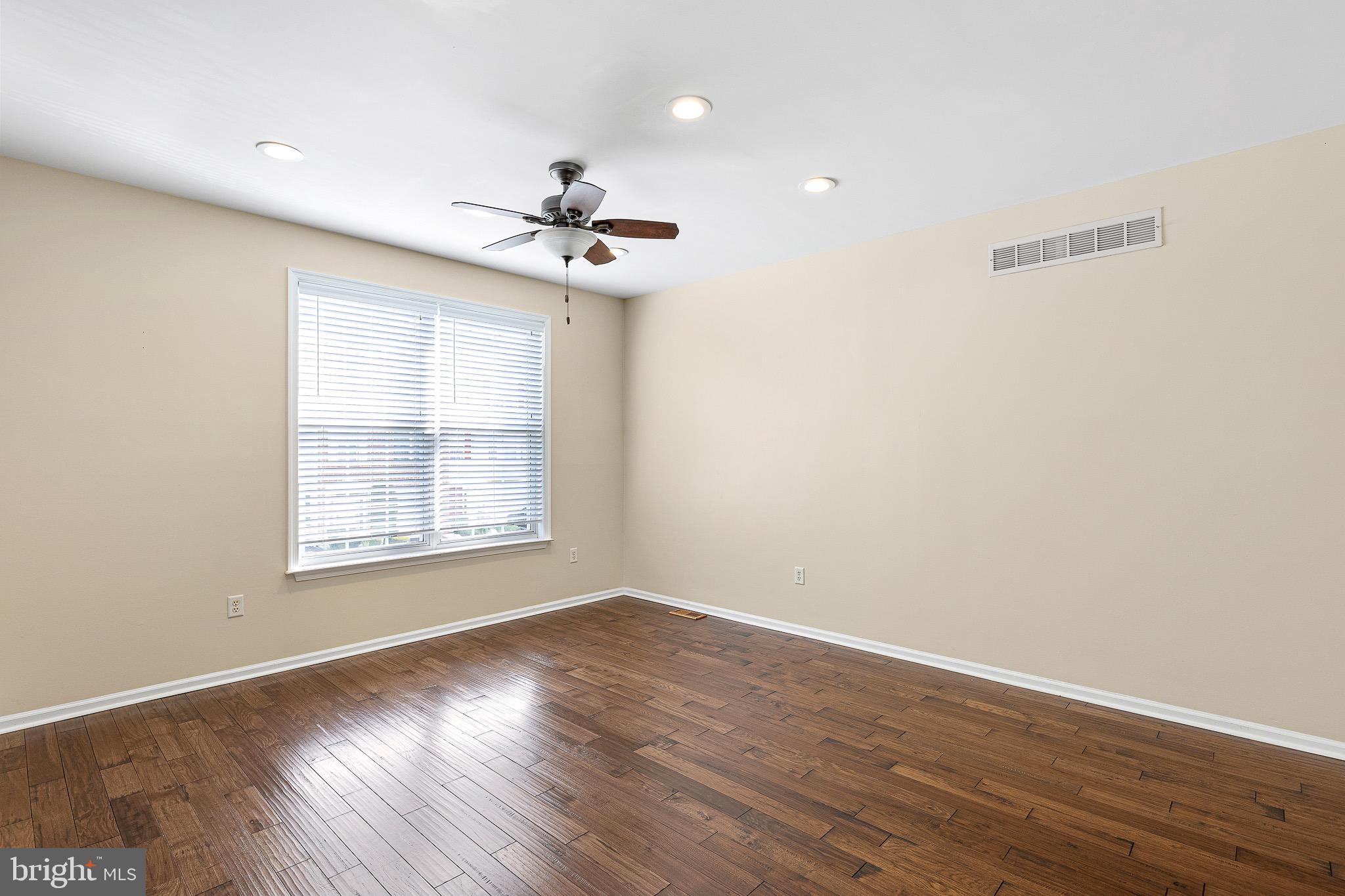 32 Ballina Boulevard Bear, DE 19701 - Photo 14 of 25 a view of an empty room with wooden floor and a window