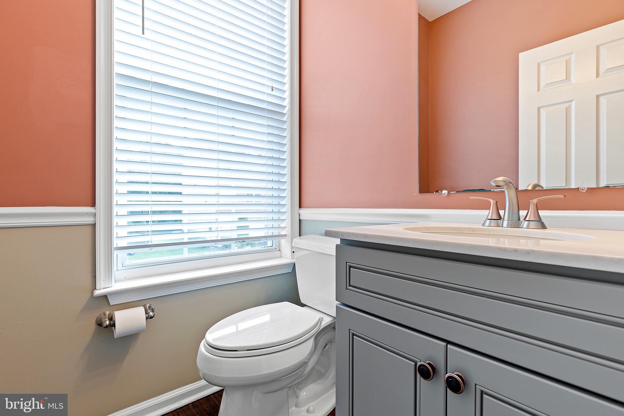 32 Ballina Boulevard Bear, DE 19701 - Photo 15 of 25 a bathroom with a sink a toilet and a window