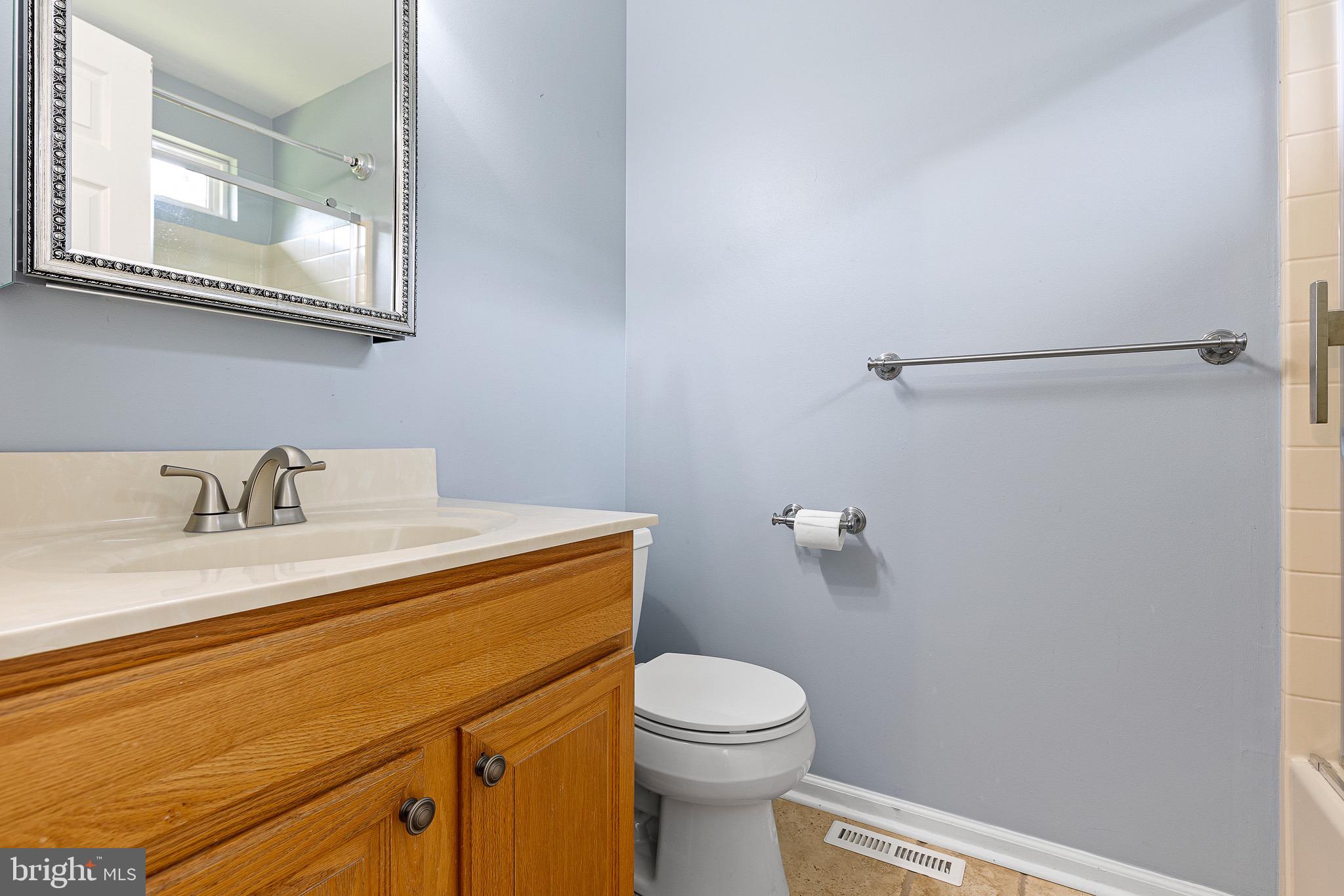 32 Ballina Boulevard Bear, DE 19701 - Photo 23 of 25 a bathroom with a granite countertop sink toilet and a mirror