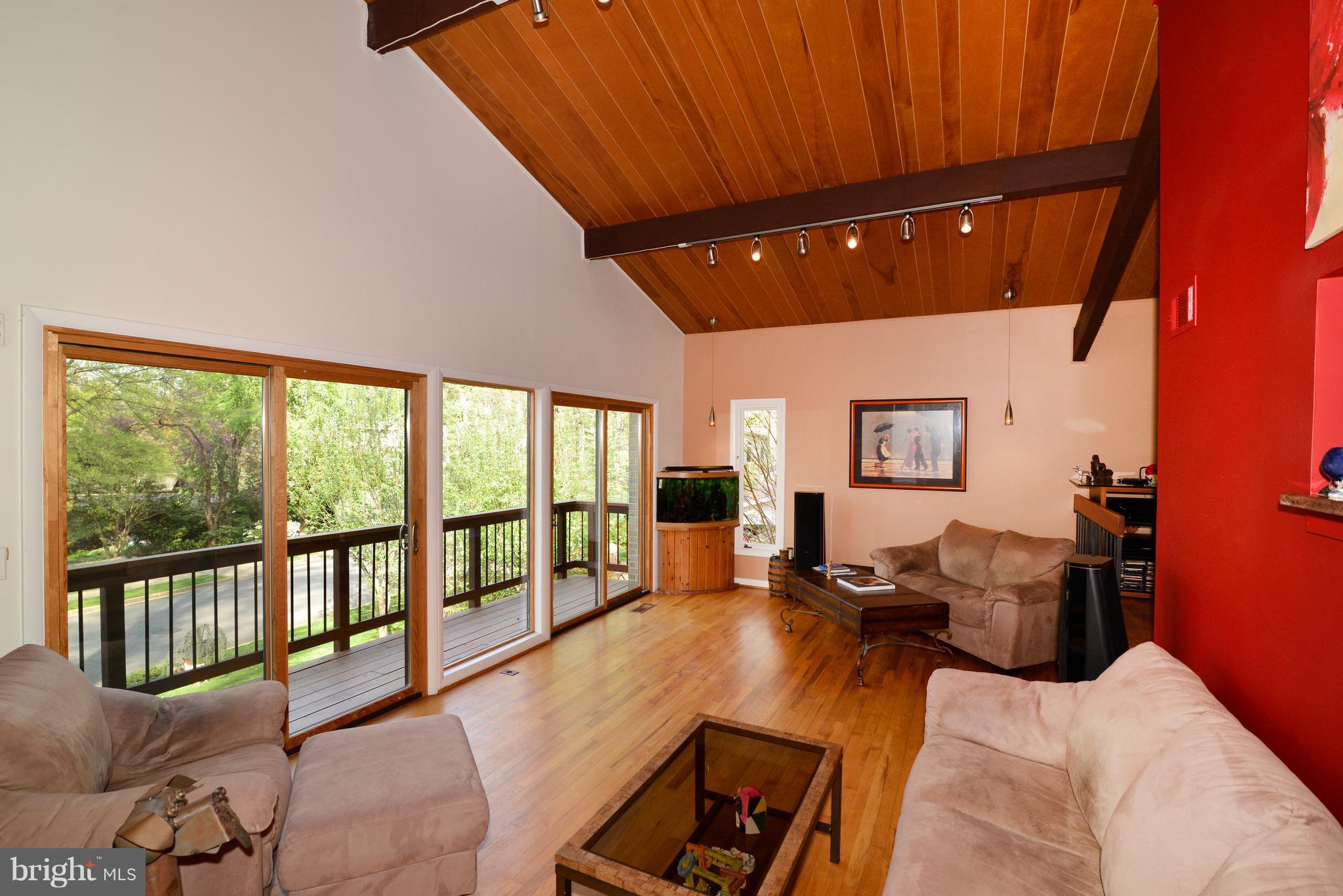 11303 South Shore Road Reston, VA 20190 - Photo 5 of 30 a living room with furniture and a large window
