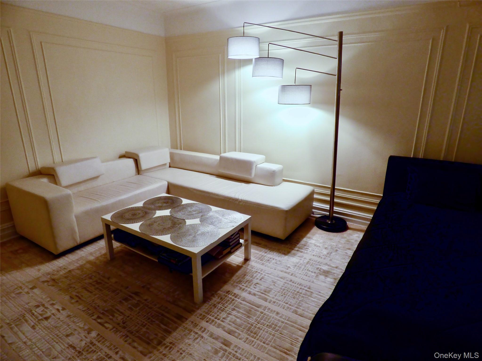 941 Jerome Avenue, Unit D5 Bronx, NY 10452 - Photo 16 of 35 a living room with furniture and a wooden floor