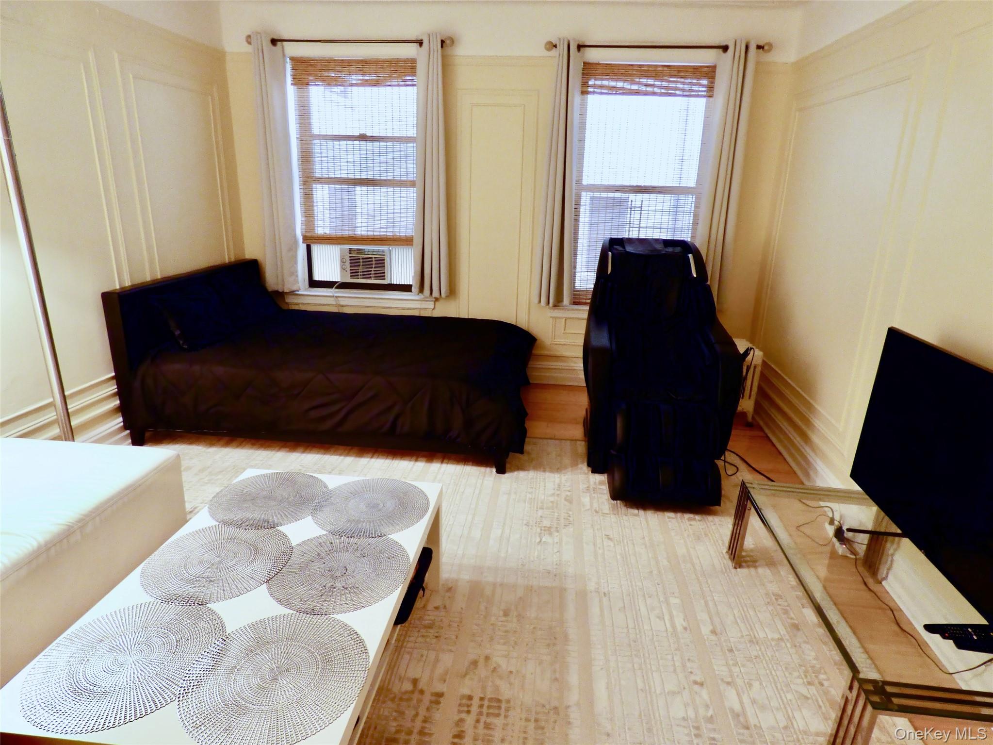 941 Jerome Avenue, Unit D5 Bronx, NY 10452 - Photo 18 of 35 a living room with furniture and a window