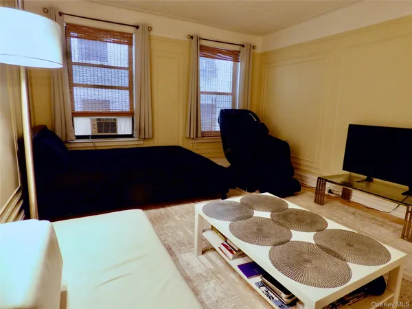 a balcony with table and chairs