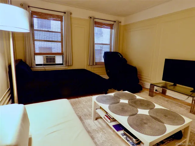 a balcony with table and chairs