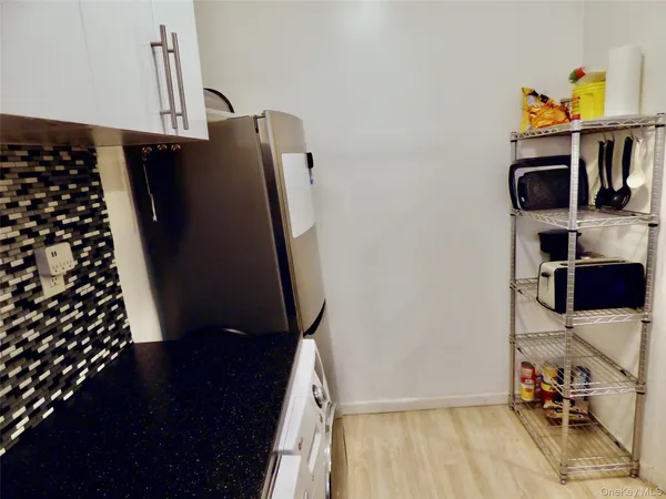 a kitchen with a sink a stove and a refrigerator