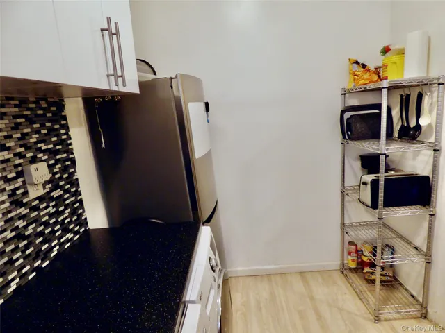 a kitchen with a sink a stove and a refrigerator
