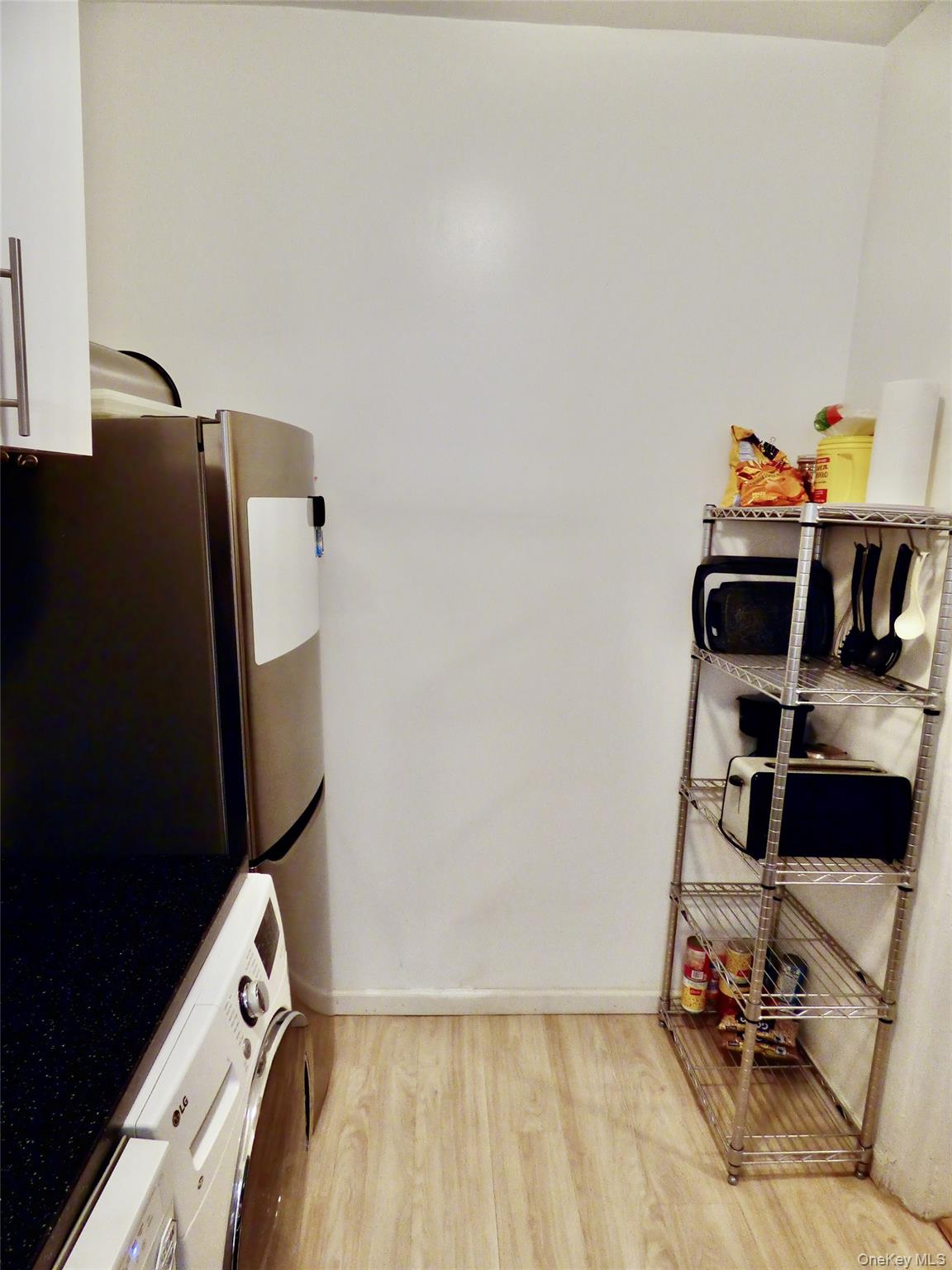 941 Jerome Avenue, Unit D5 Bronx, NY 10452 - Photo 25 of 35 a view of workspace with wooden floor and gym equipment