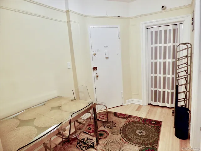 a living room with a couch and a rug