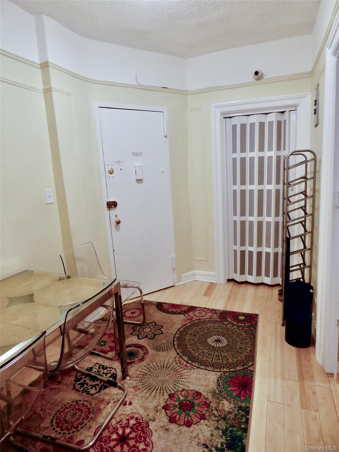 941 Jerome Avenue, Unit D5 Bronx, NY 10452 - Photo 28 of 35 a living room with a couch and a rug