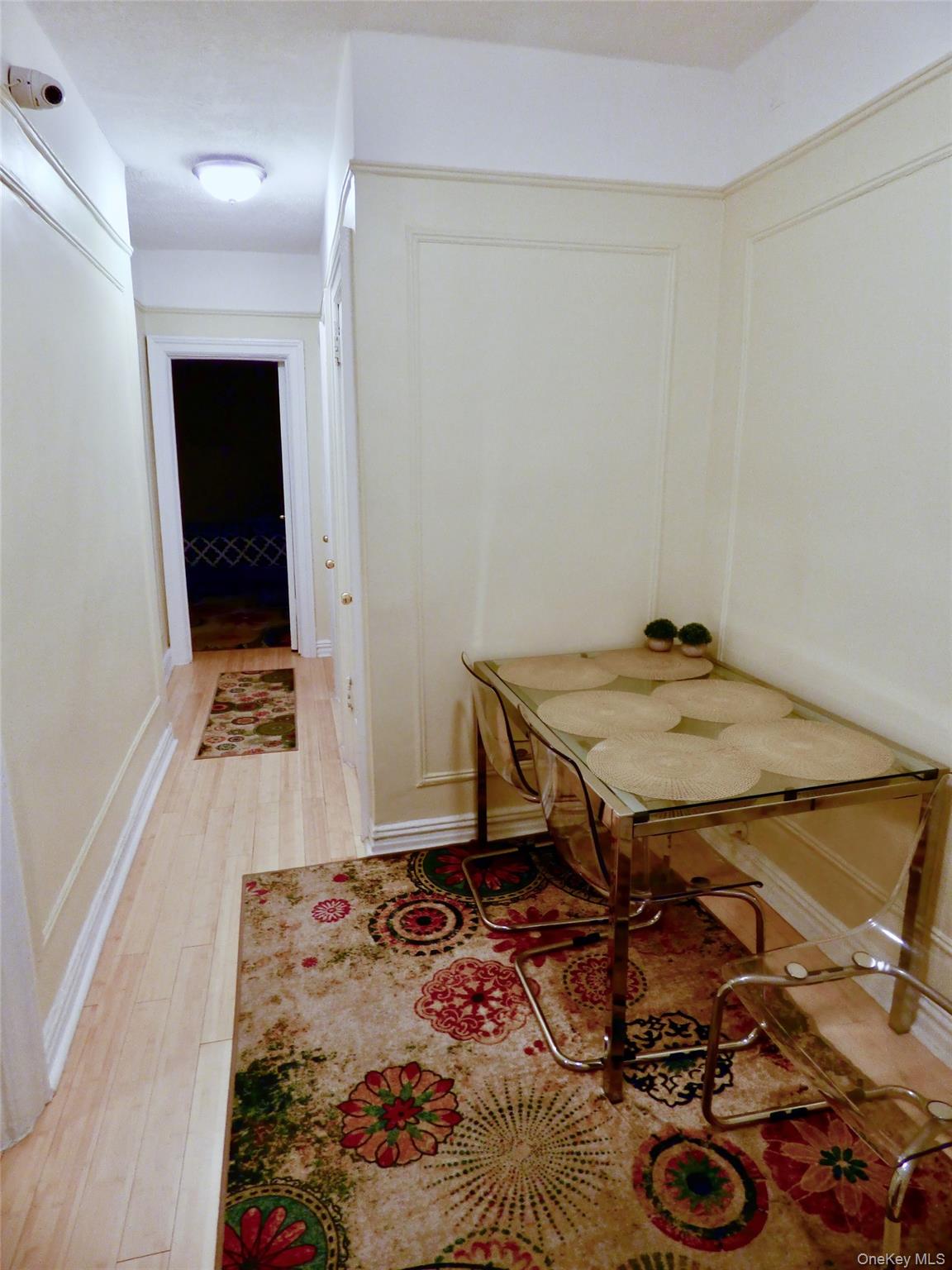 941 Jerome Avenue, Unit D5 Bronx, NY 10452 - Photo 29 of 35 wooden floor with a table and a stove