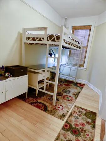 a close view of a stove and kitchen with wooden floor