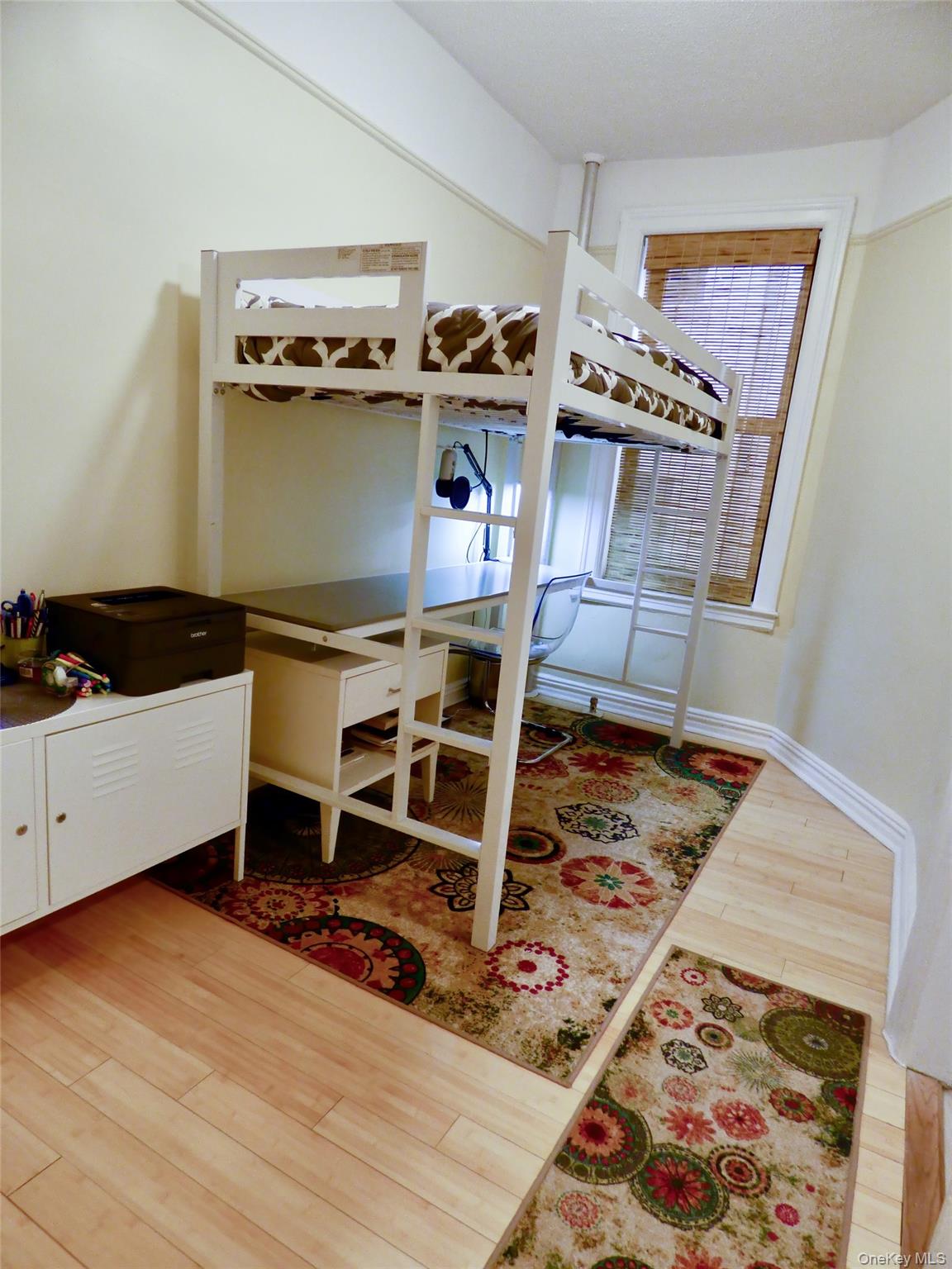 941 Jerome Avenue, Unit D5 Bronx, NY 10452 - Photo 31 of 35 a bed room with a bed and a chair