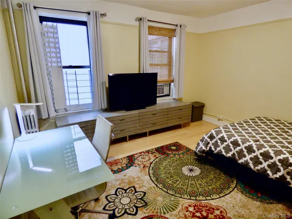 a living room with furniture and a window
