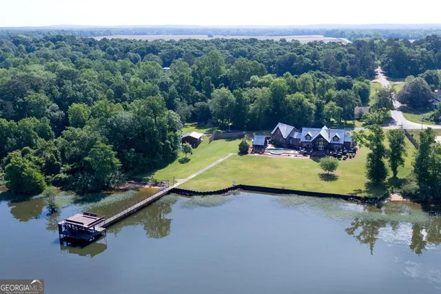 a view of a swimming pool with a bench