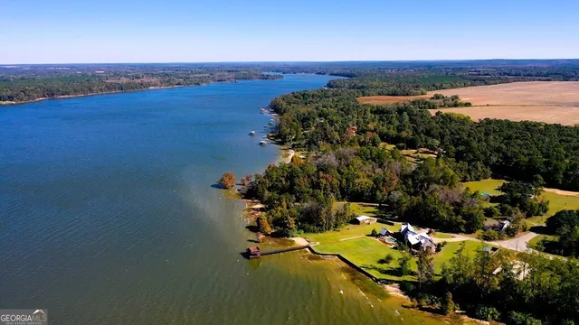 an aerial view of a house with a ocean view