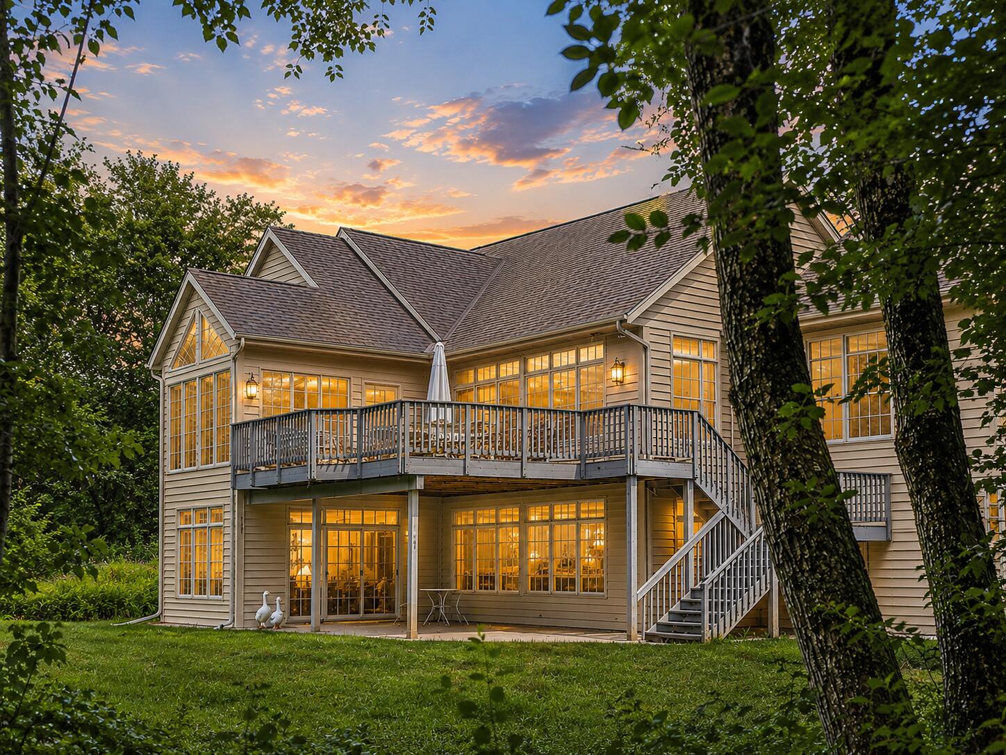 W291-s5245 Ridgefield Road Waukesha, WI 53189 - Photo 44 of 44 The walkout ranch offers exceptional privacy, expansive windows, a 32’ x 16’ composite deck, and covered patio overlooking the wooded 3-acre setting. (Enhanced Photo)