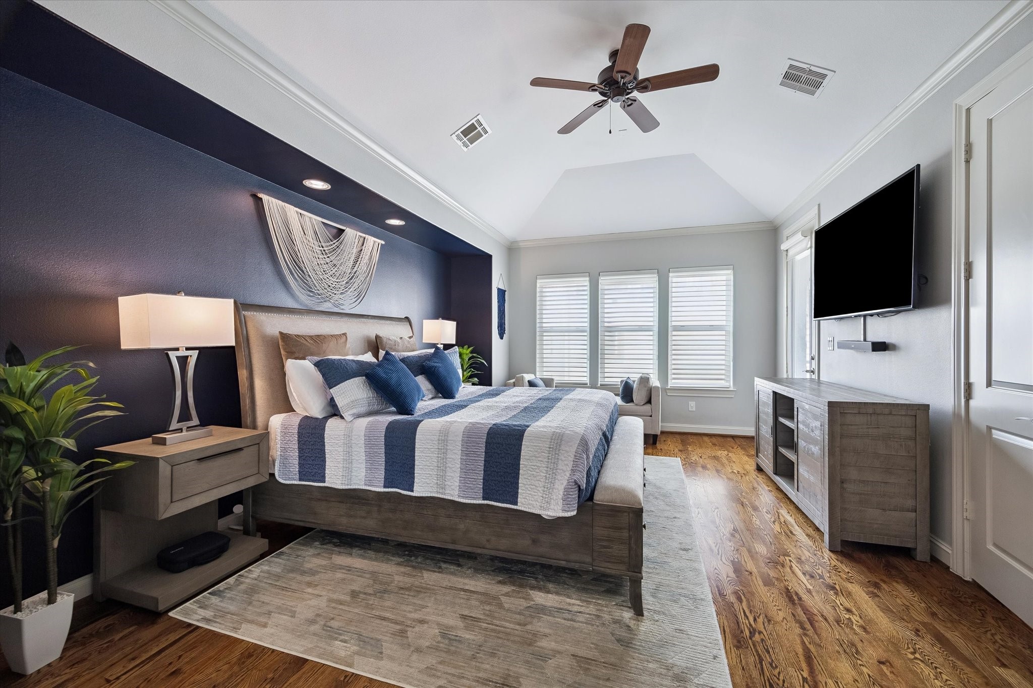 2703 Arabelle Grove Houston, TX 77007 - Photo 15 of 37 The primary suite, on the third floor features raised ceilings, and gorgeous hardwood floors