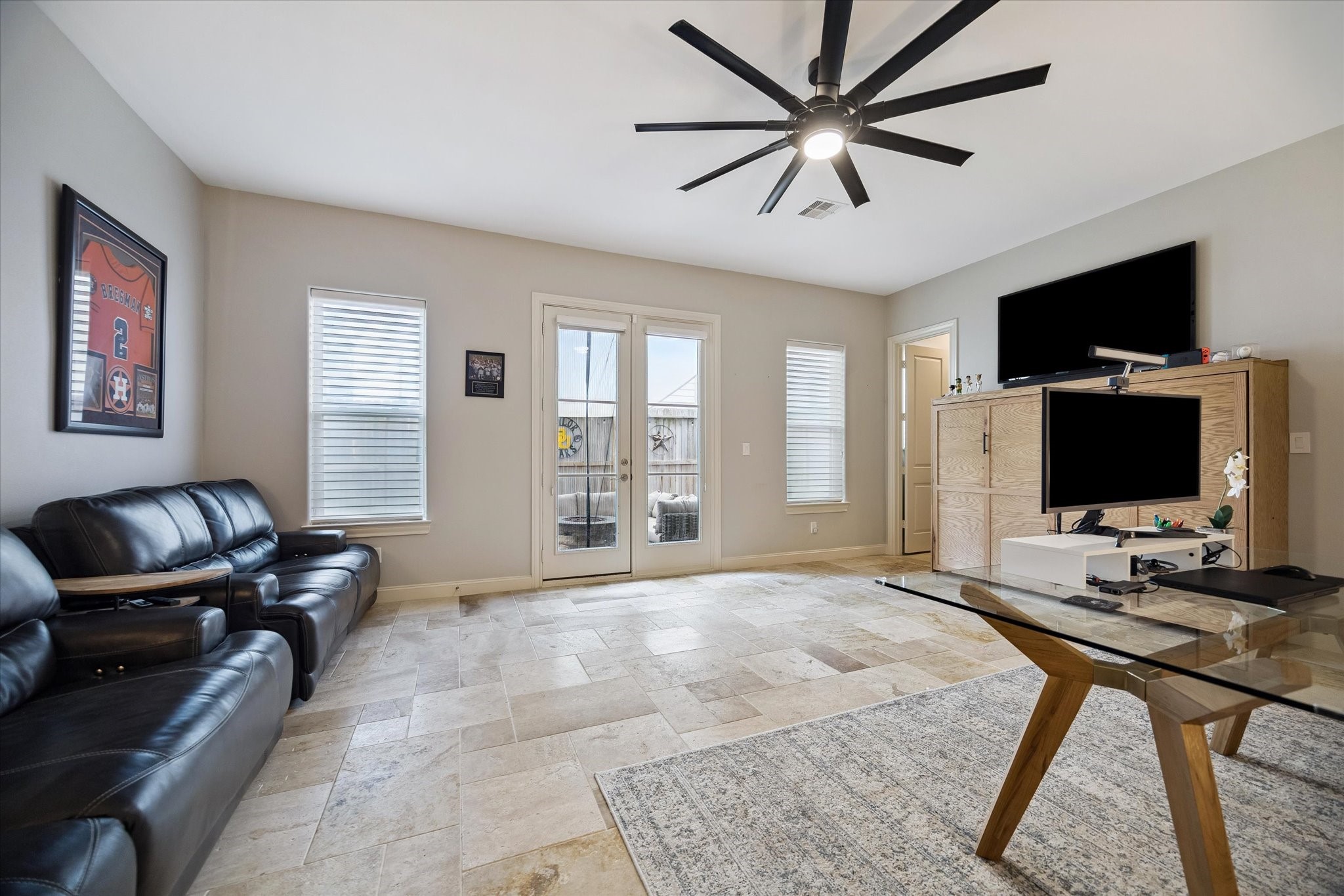 2703 Arabelle Grove Houston, TX 77007 - Photo 24 of 37 Huge downstairs bedroom opens to the backyard. Great for entertaining, guest suite, home office, or workout room