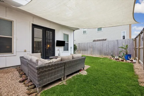 a living room with furniture and a garden