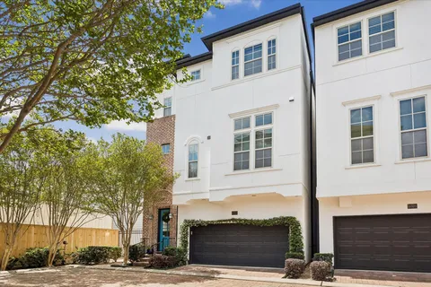 a front view of residential houses with street