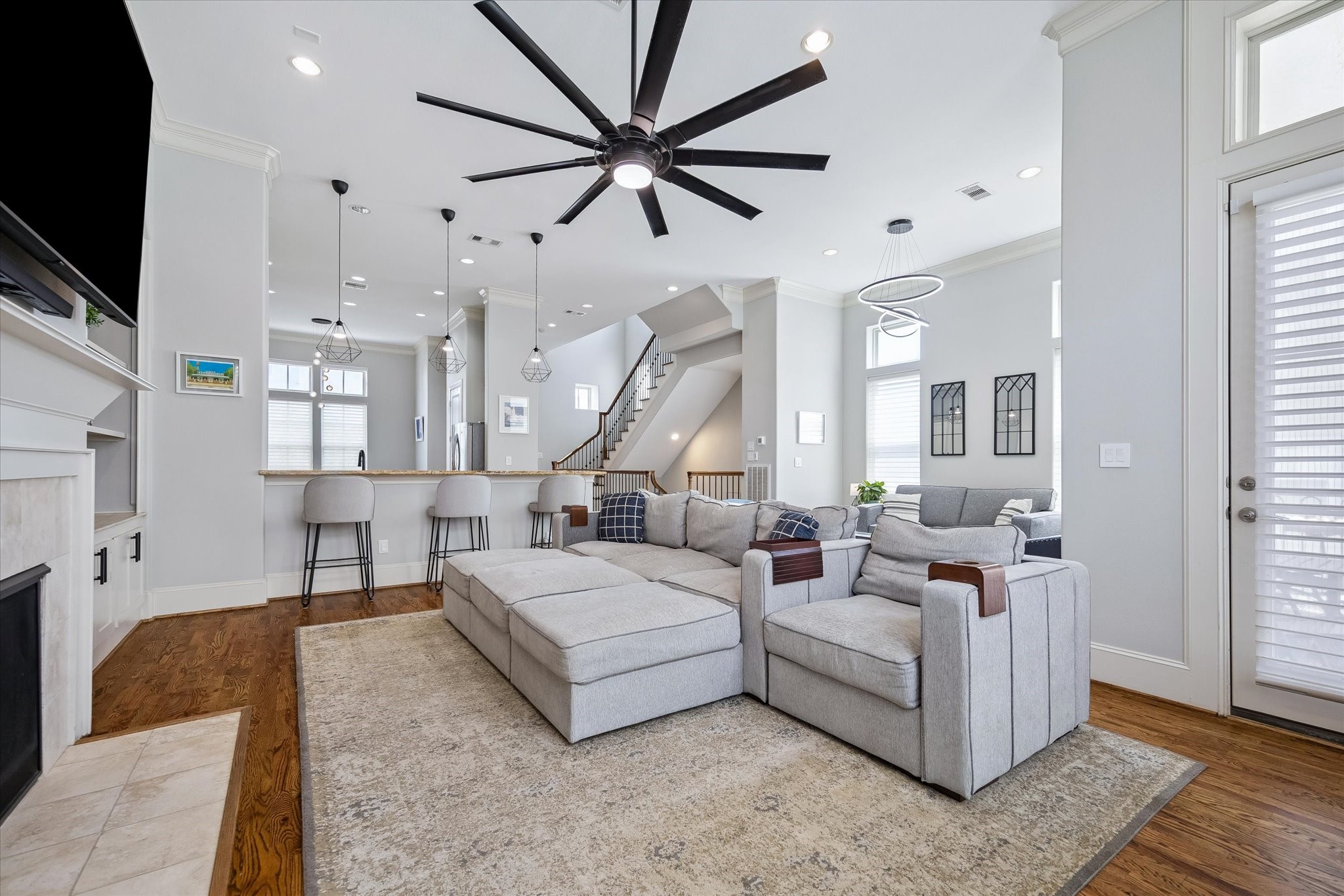 2703 Arabelle Grove Houston, TX 77007 - Photo 5 of 37 The living room has high ceilings and a fireplace with built-in cabinetry