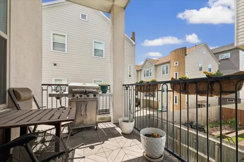 a view of a chairs and table in the patio