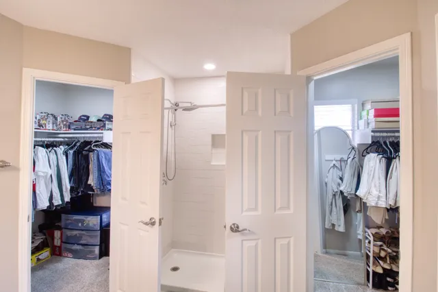 a view of a livingroom with furniture and a window
