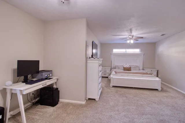 a view of a livingroom with furniture and flat screen tv