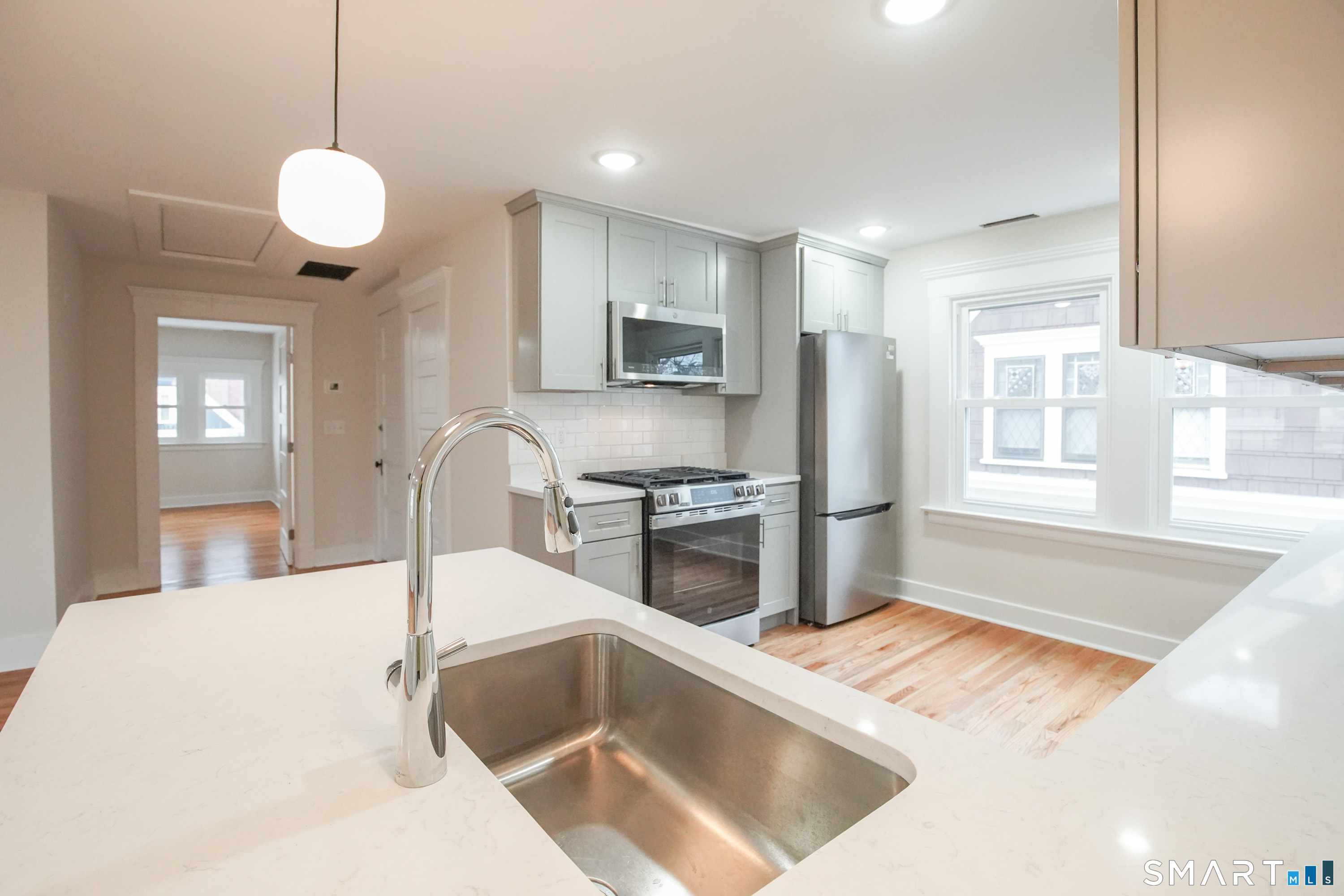 56 Pendleton Street, Unit 3 New Haven, CT 06511 - Photo 4 of 20 a kitchen with a refrigerator and a sink