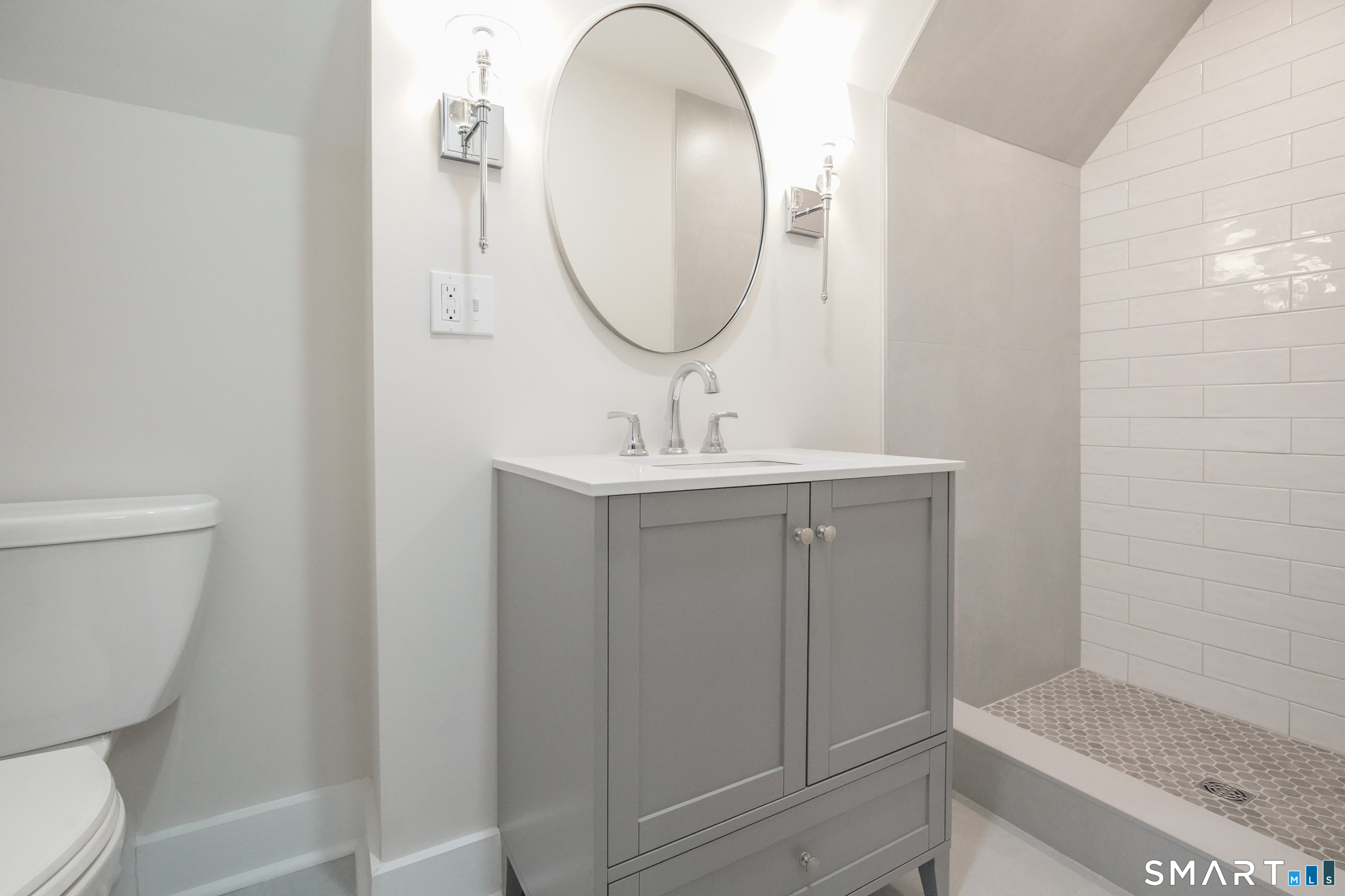 56 Pendleton Street, Unit 3 New Haven, CT 06511 - Photo 10 of 20 a bathroom with a sink toilet and a mirror