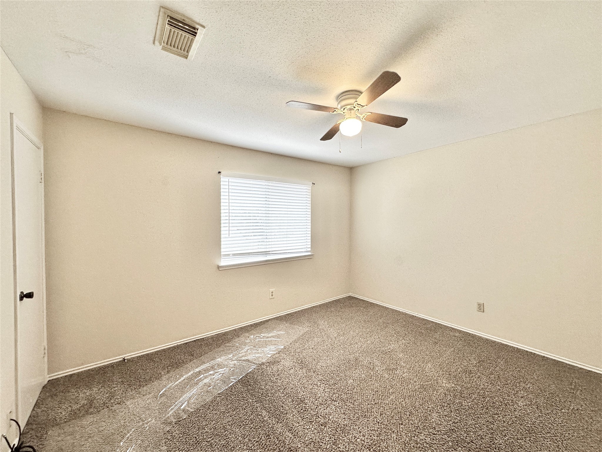 16827 Ashbridge Court Spring, TX 77379 - Photo 16 of 22 a view of an empty room with a window