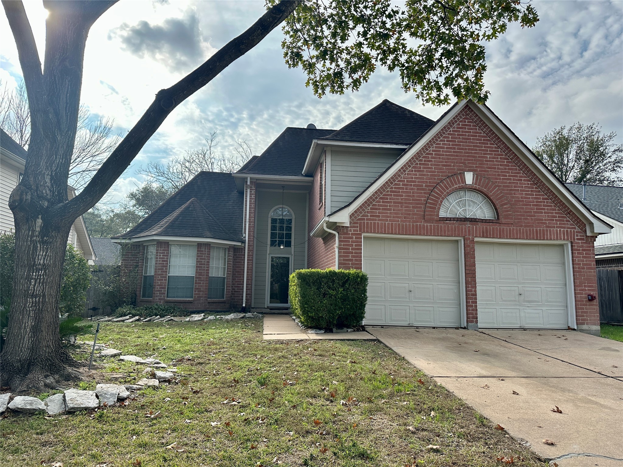 16827 Ashbridge Court Spring, TX 77379 - Photo 2 of 22 a view of a house with a yard and garage