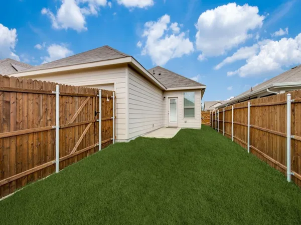a view of backyard with green space