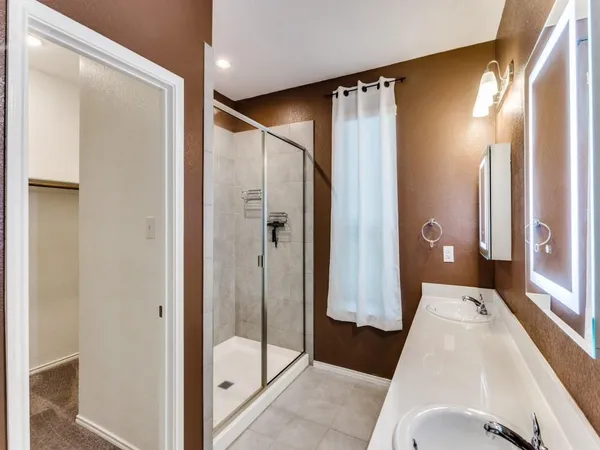 a bathroom with a tub and shower